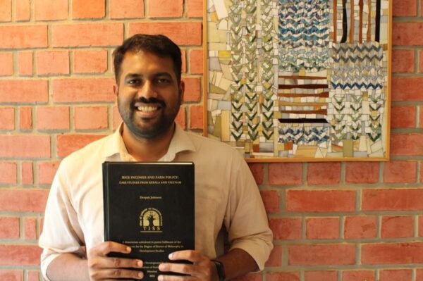 Dr. Deepak Johnson with his PhD Thesis